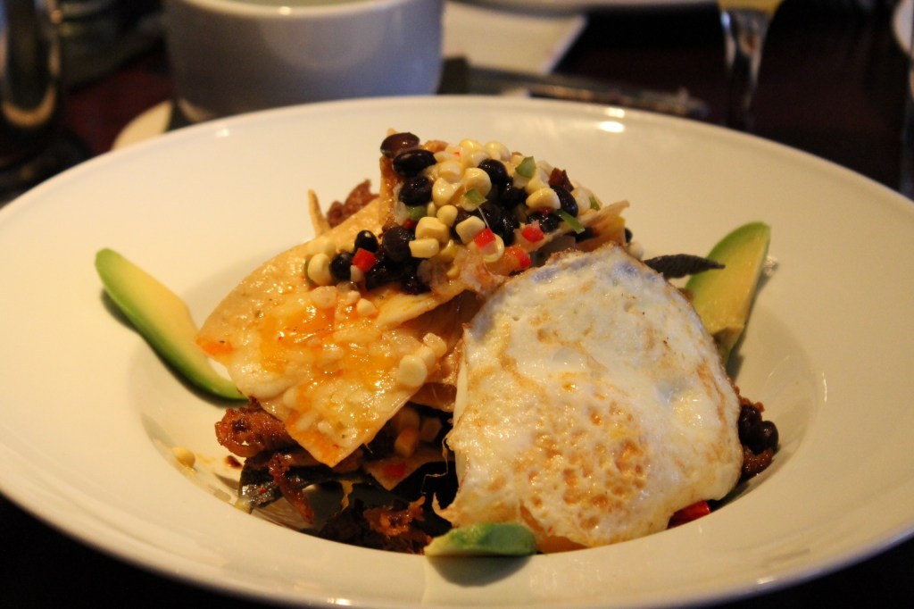 Duck confit and house made nachos, corn and black bean salsa, chorizo,t opted with cheese and a fried egg