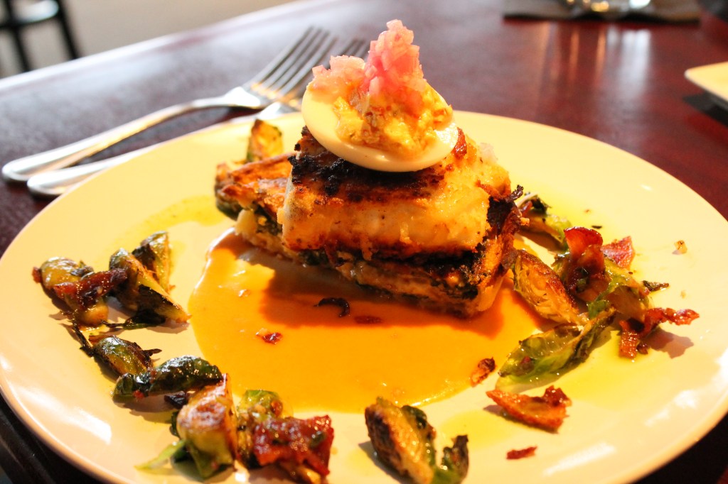 Potato crusted halibut over bacon, spinach, cheese quiche, brussel sprouts w/ deviled egg