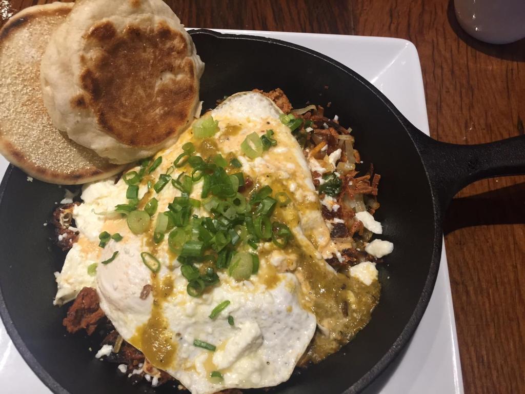 Green Eggs & Ham (Chorizo, Dippy Egg, Salsa Verde, Chile-Lime Crema on hash browns.